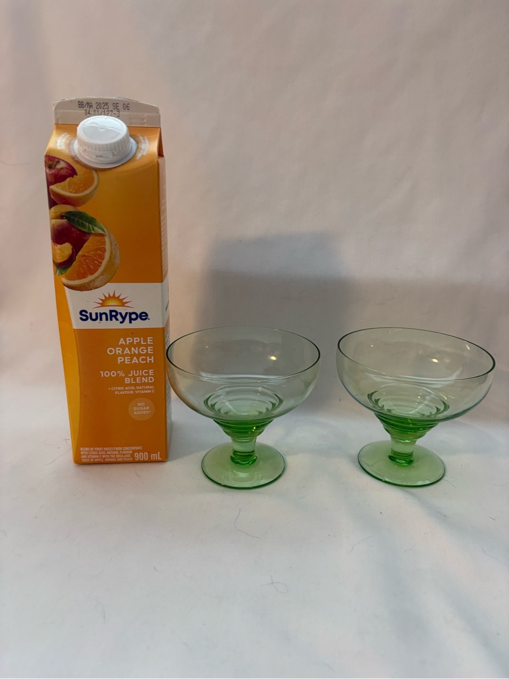 Set of 2- pale green, coupe footed glasses